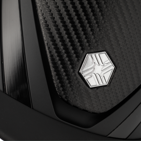 Charles Owen Hyda Carbon riding hat in Black Matte/Black Gloss, close-up of the brushed metal crown badge